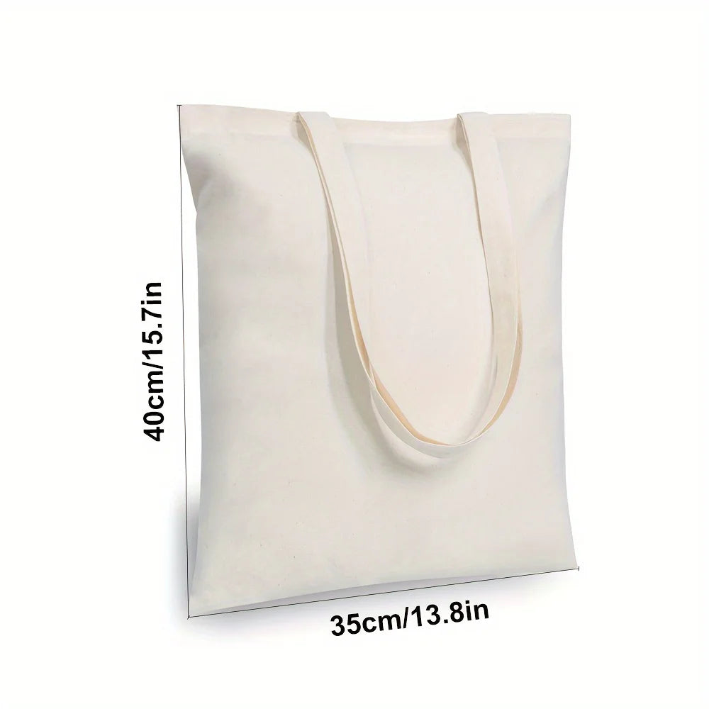 Sac en toile de coton blanc avec anses beige clair, vu de face.