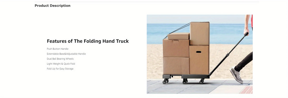 A person is pushing a brown folding hand truck luggage cart across a sandy area near the sea.