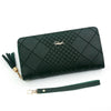 A dark green quilted clutch wallet with gold accents and a matching leather strap.