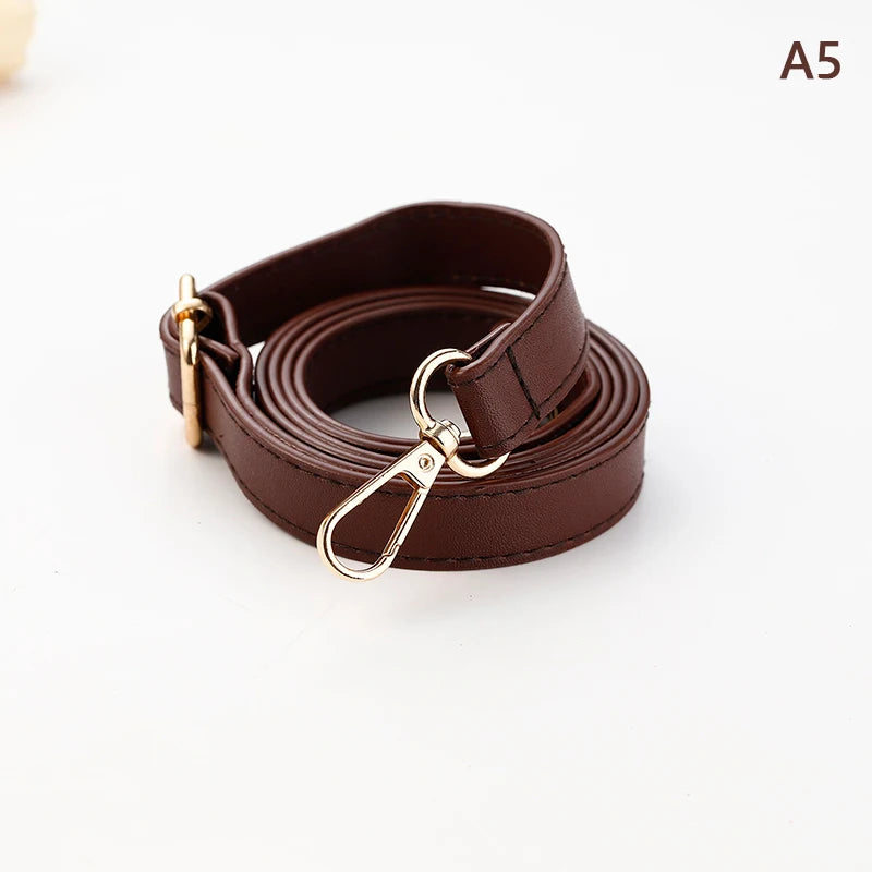 A brown PU leather strap for a crossbody bag, shown coiled and with a metal clasp.
