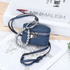 A dark blue leather coin purse with a silver chain and lanyard is displayed on a white background.