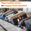 Close-up of luggage identification straps with high-visibility colors on various suitcases.