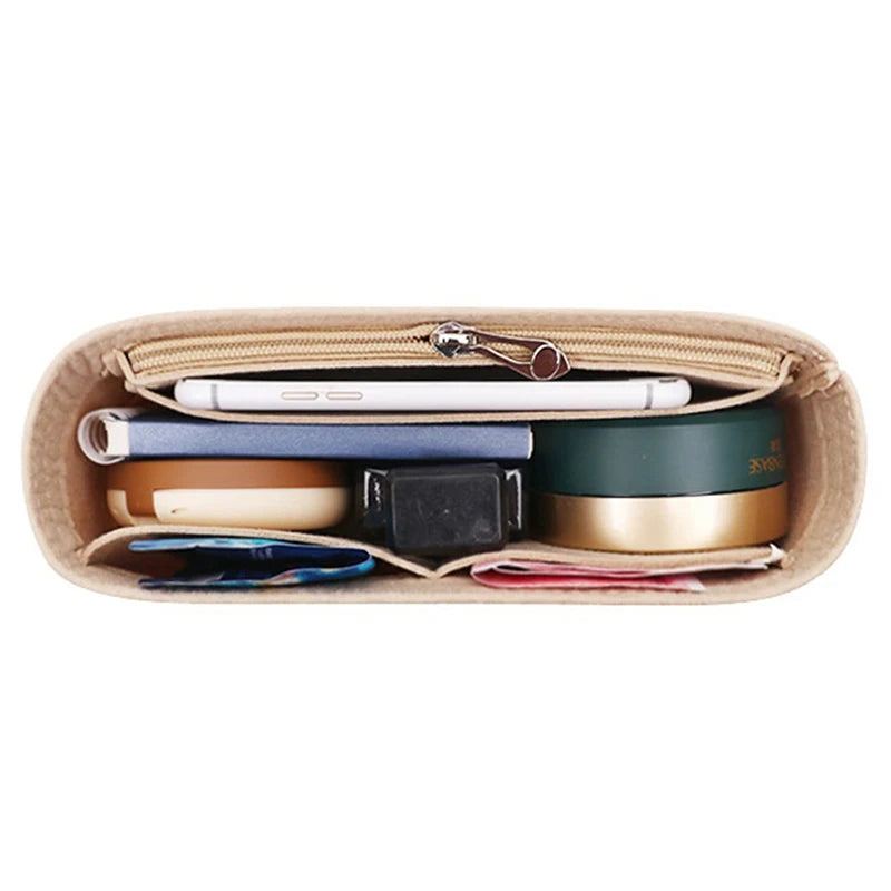 A felt bag insert organizer showing various compartments and fabric inserts for organizing handbags.