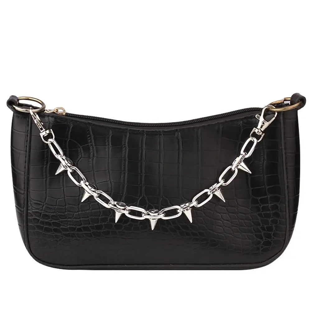 Black crocodile print purse with a silver chain strap
