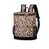 A patterned leopard print backpack with black trim and a black strap.