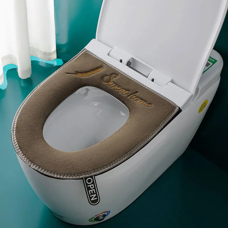 A white toilet seat with a beige plush waterproof cover open, showing the clean white bowl.