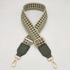 A beige and olive checkered braided nylon bag strap with metal hooks.