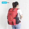 A red small travel backpack with a black rain cover is shown being worn by a woman.