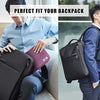 A man is fitting a black portable digital organizer storage pouch into his backpack.