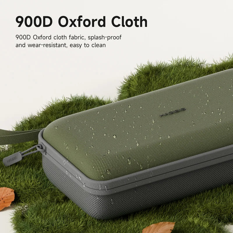 Bolsa de tela Oxford verde oliva oscura para organizar cables electrónicos, sobre hierba verde.