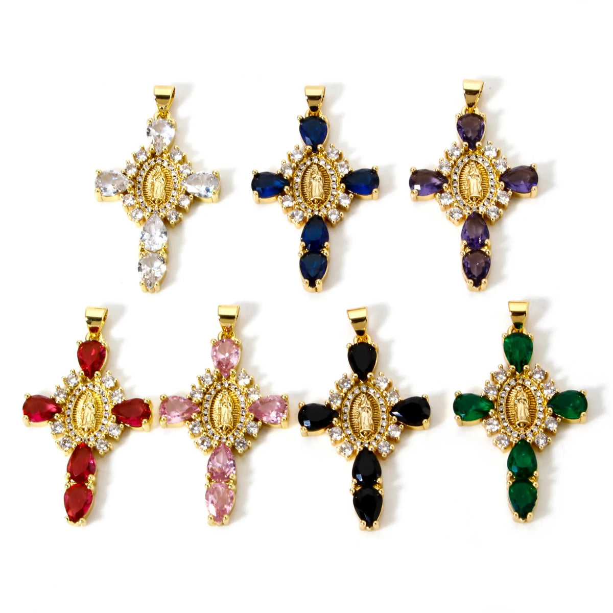 A set of gold-plated cross and Virgin Mary charm pendants featuring cubic zirconia stones in blue, purple, pink, and green.