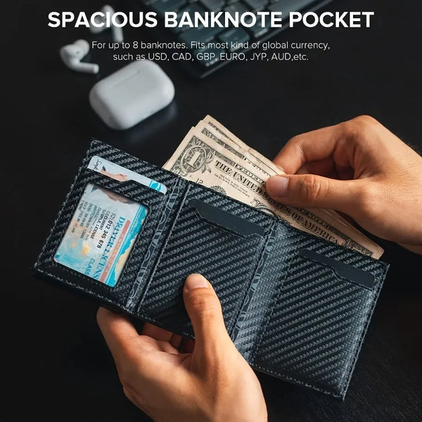 A hand holds a black minimalist pop-up credit card wallet displaying US dollar bills.