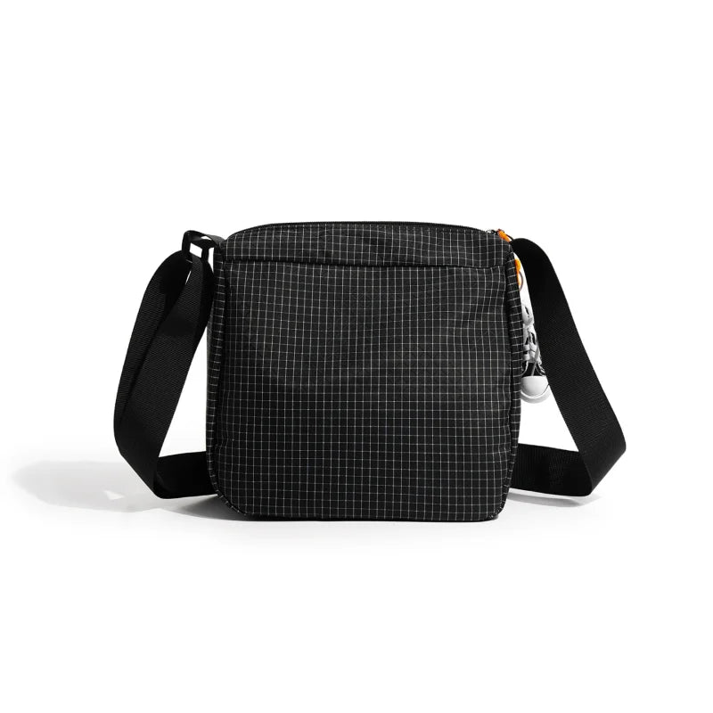 Black plaid water resistant crossbody shoulder bag with black strap