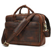A brown vintage genuine leather briefcase with leather straps and brass hardware.
