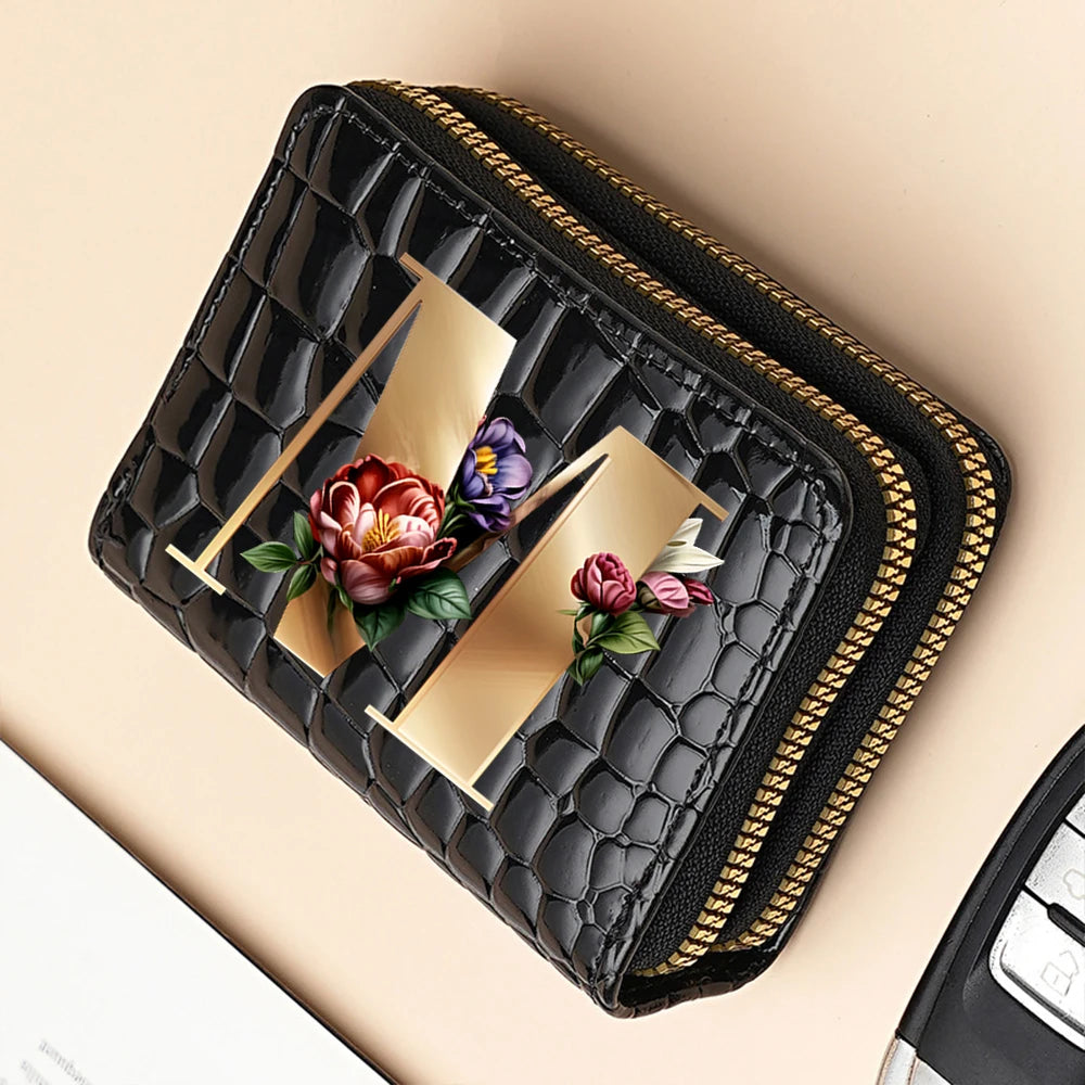 A black PU leather double-zip clutch wallet with a gold accent and a cartoon print design.