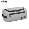 A gray, rectangular travel toiletry bag with black accents and zipper closures.