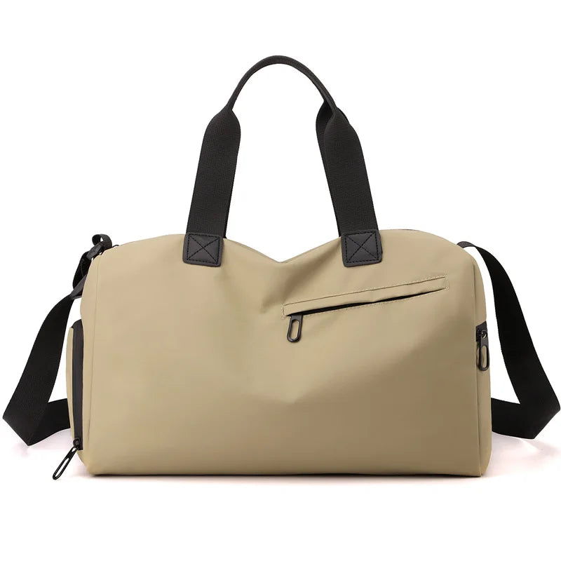 A beige waterproof travel duffle bag with black straps and a separate shoe compartment.