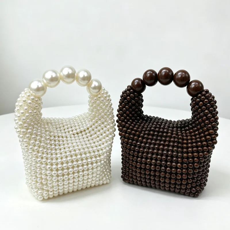 A white pearl beaded clutch bag and a dark brown beaded clutch bag displayed side by side.