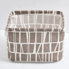 A rectangular storage basket made of linen fabric with a striped pattern in brown and off-white.