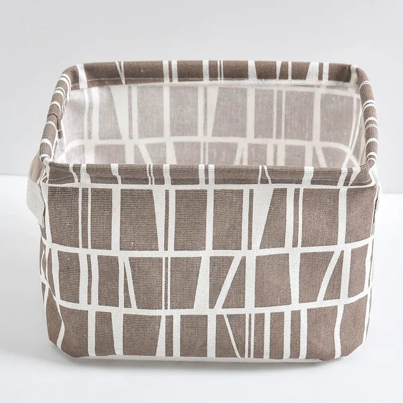 A rectangular storage basket made of linen fabric with a striped pattern in brown and off-white.