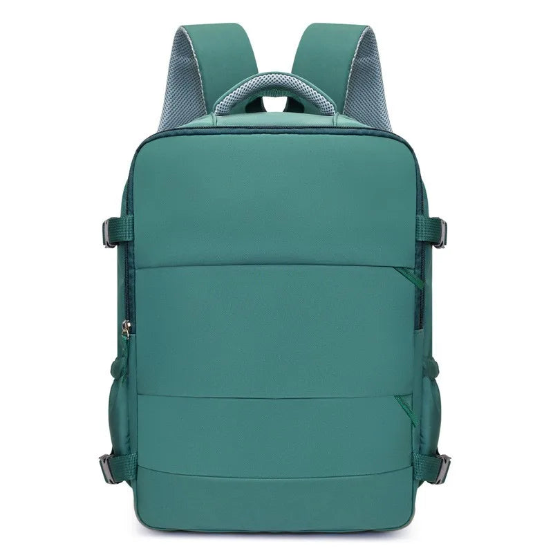 A teal compact travel backpack with gray mesh straps on the top