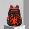 An orange and black fashion kids backpack featuring a large spider design on the front.
