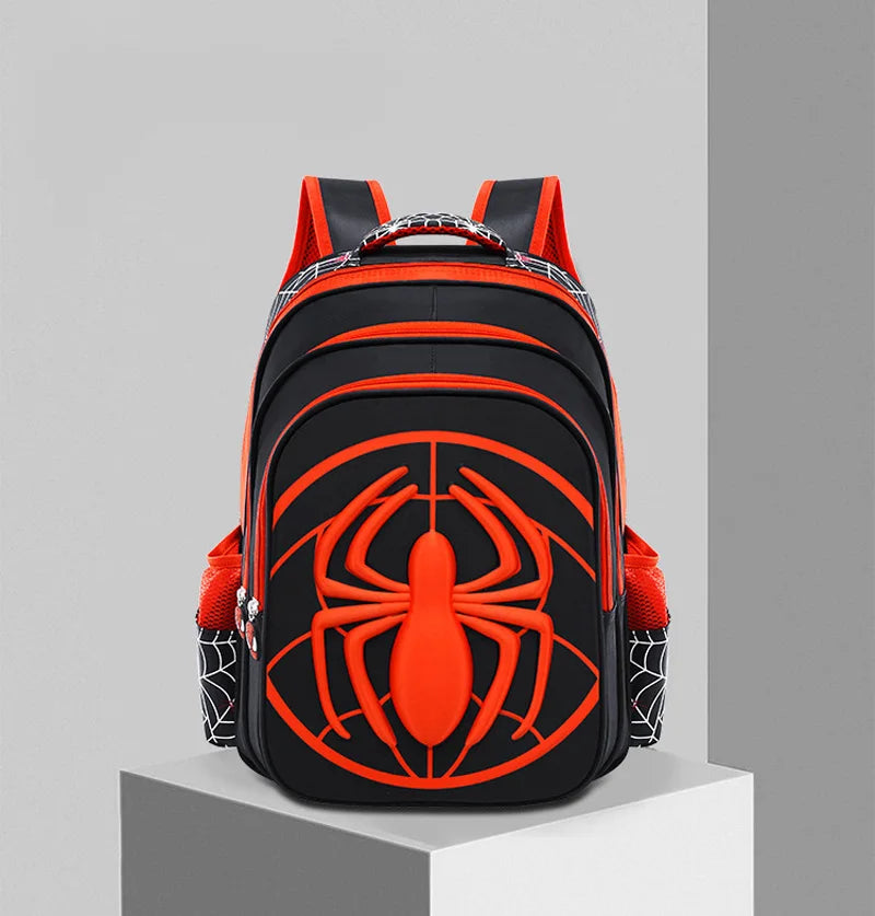 An orange and black fashion kids backpack featuring a large spider design on the front.