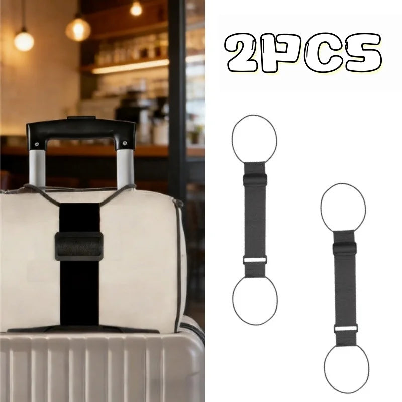Two black nylon luggage straps are shown next to a white suitcase.