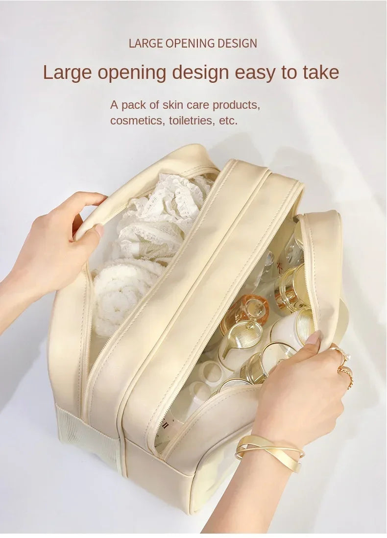 A beige large opening design pouch filled with skincare products and cosmetics being held by a hand.