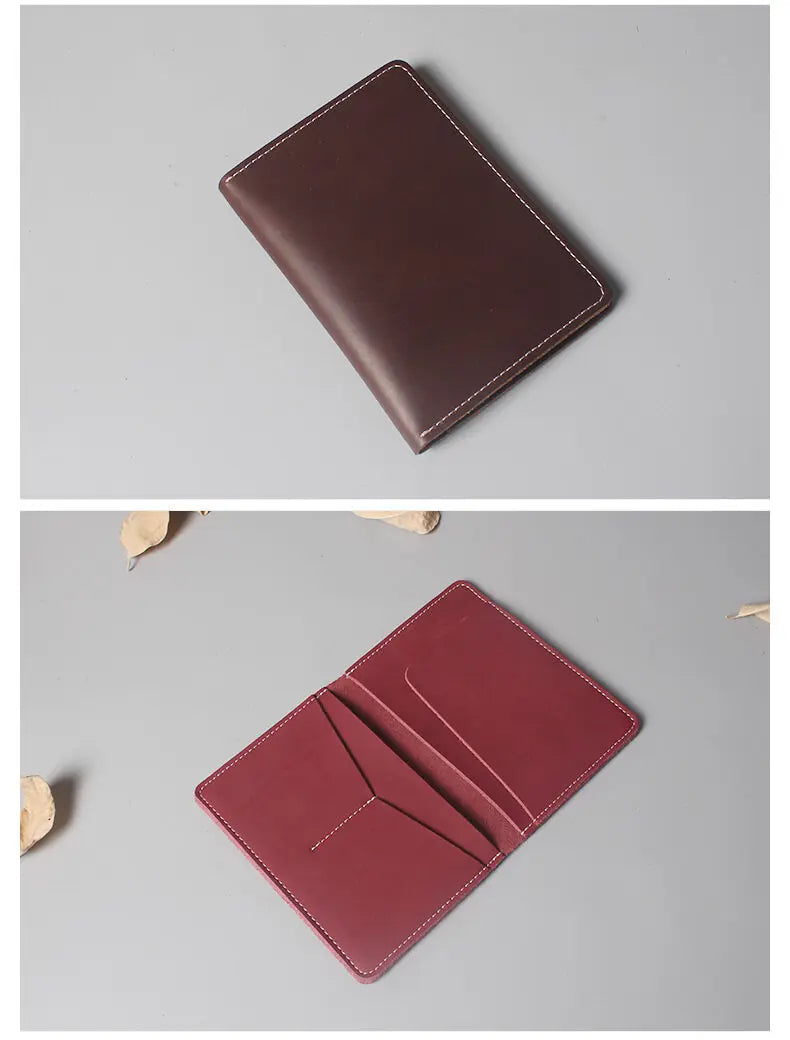 A dark burgundy genuine cowhide leather passport and ticket holder displayed at an angle.