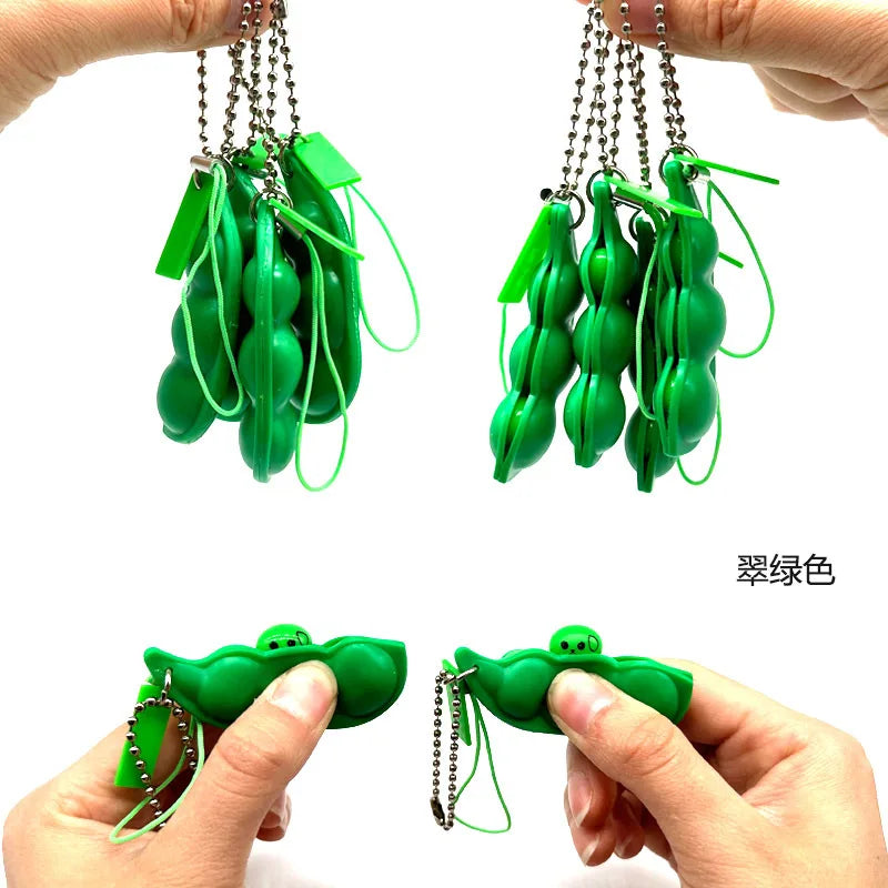 Green silicone fidget toy keychains being held by hands