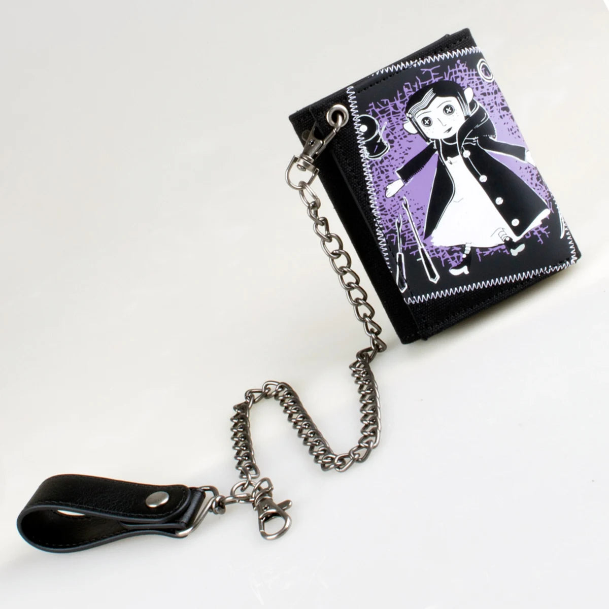 A black tri-fold chain card holder wallet with a purple and white graphic design and attached silver chain.