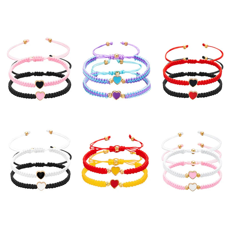 A collection of colorful beaded friendship bracelets featuring hearts in various colors like pink, blue, red, and yellow.