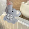 A soft gray plush elephant case is shown being held, featuring a white protective cover for AirPods.