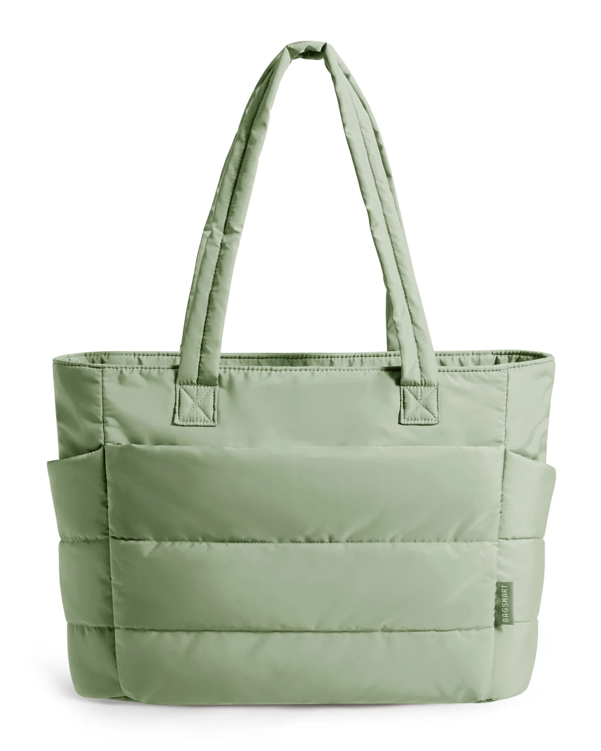 A sage green quilted tote bag with long handles.