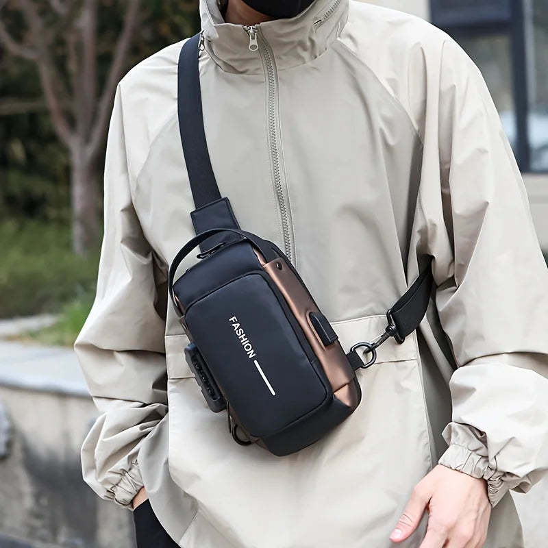 A person wearing a beige jacket is holding a black Oxford sling chest bag with a leather strap.
