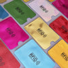 A collection of ten anti-RFID blocking card holders in various colors including green, pink, yellow, and blue.