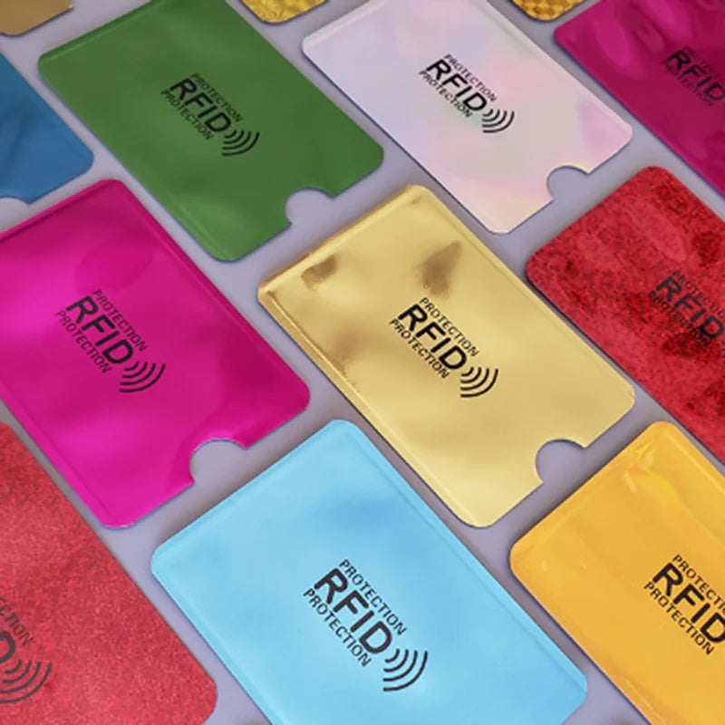 A collection of ten anti-RFID blocking card holders in various colors including green, pink, yellow, and blue.