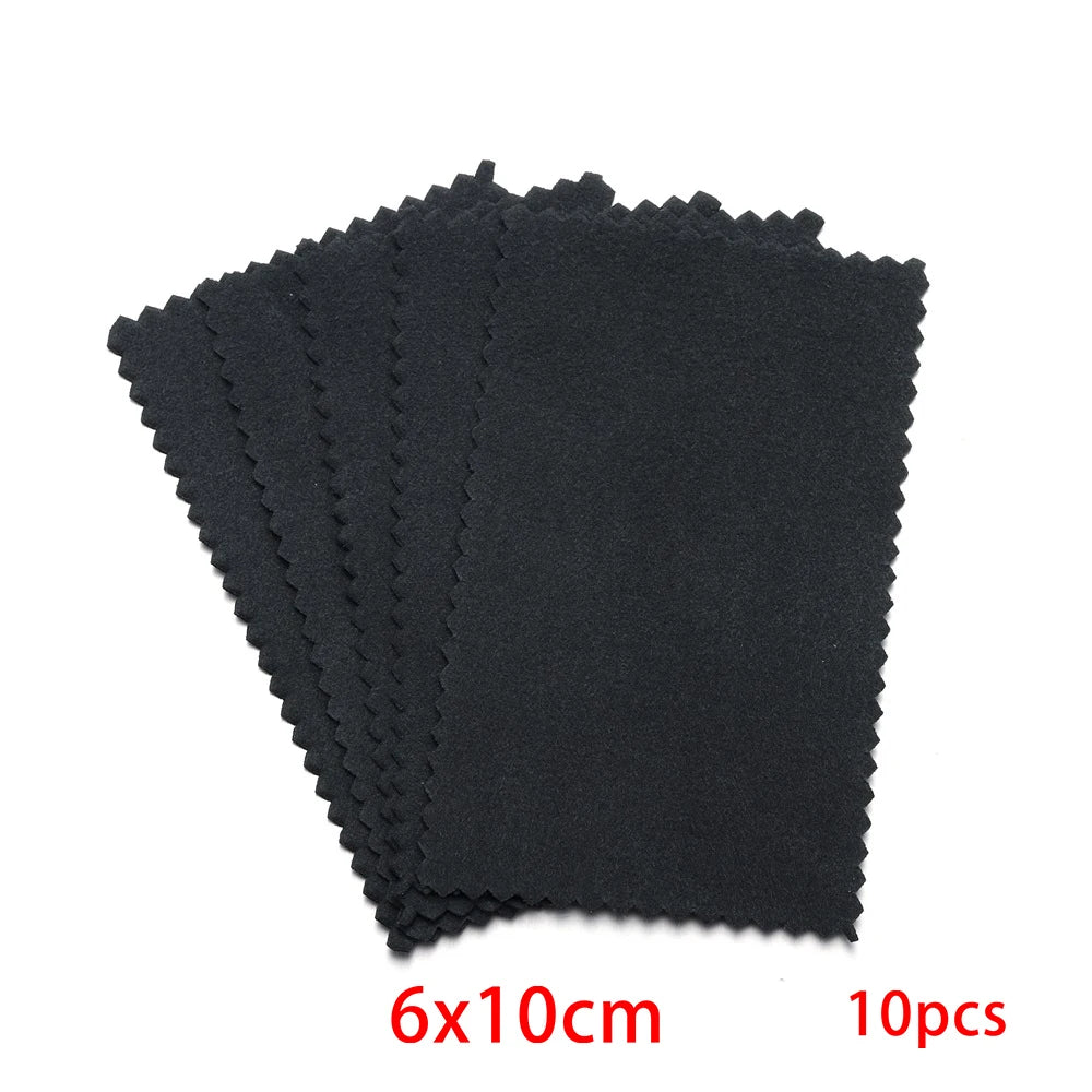 A stack of ten black polishing cloths for silver and gold jewelry, measuring 6x10cm each.