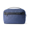 A dark blue travel toiletry organizer bag with a black handle and a black name tag on the front.
