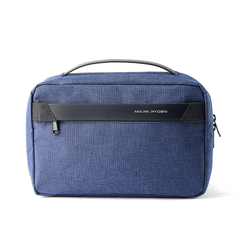 A dark blue travel toiletry organizer bag with a black handle and a black name tag on the front.