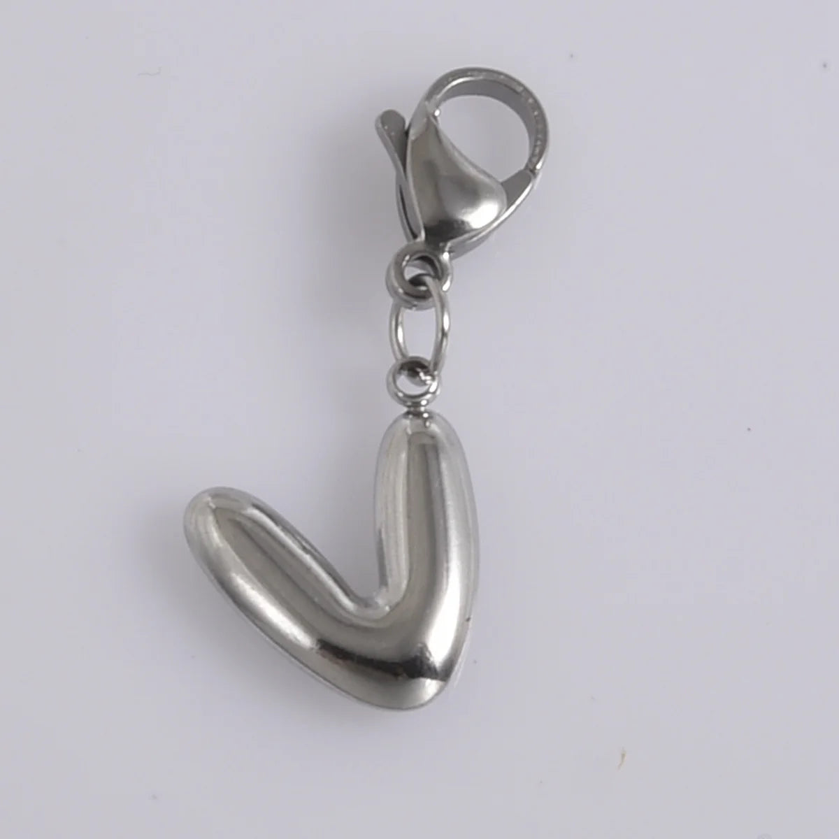 Silver stainless steel alphabet letter charm with a lobster clasp.