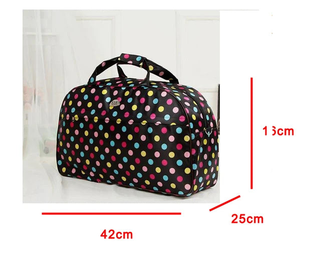 A black PU leather travel duffel bag with a handle, featuring a pattern of multi-colored polka dots.