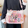A person holds a pink Y2K aesthetic transparent shoulder tote bag with various ticket and photo inserts.
