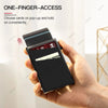 A hand holds a black card holder with multiple cards, demonstrating one-finger access.