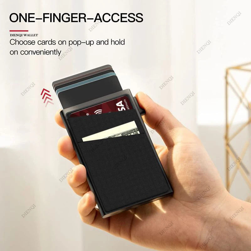 A hand holds a black card holder with multiple cards, demonstrating one-finger access.