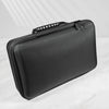 A black premium leather watch organizer travel case shown from above on a white marble surface.