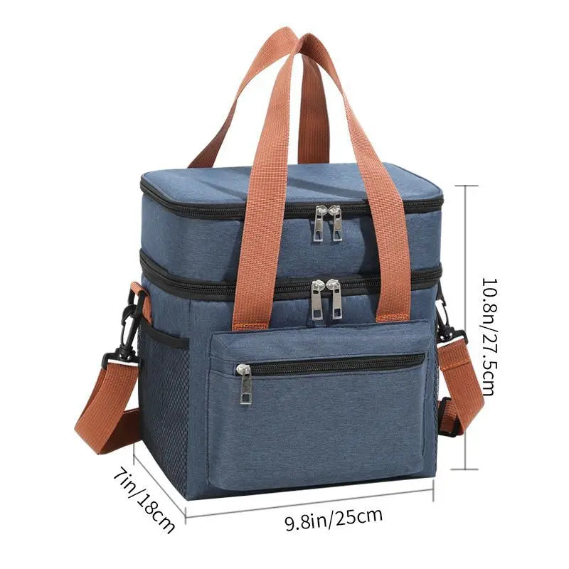 Bolsa térmica azul marino para picnic con correas marrones y compartimentos con cremallera.