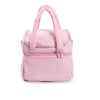 A pink quilted insulated lunch bag for women with a carrying handle.