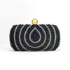 Schwarze Diamantperle-Opfer-Clutch mit goldfarbener Schnalle.
